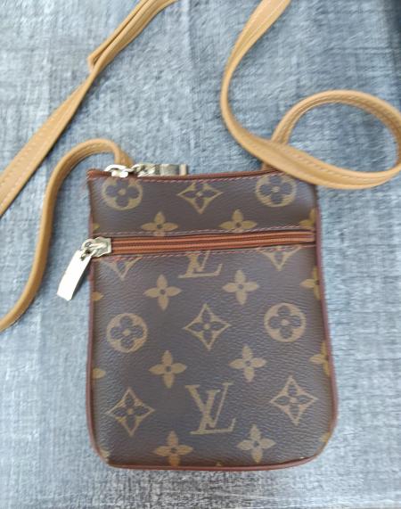 Pochette mixte en cuir état neuf